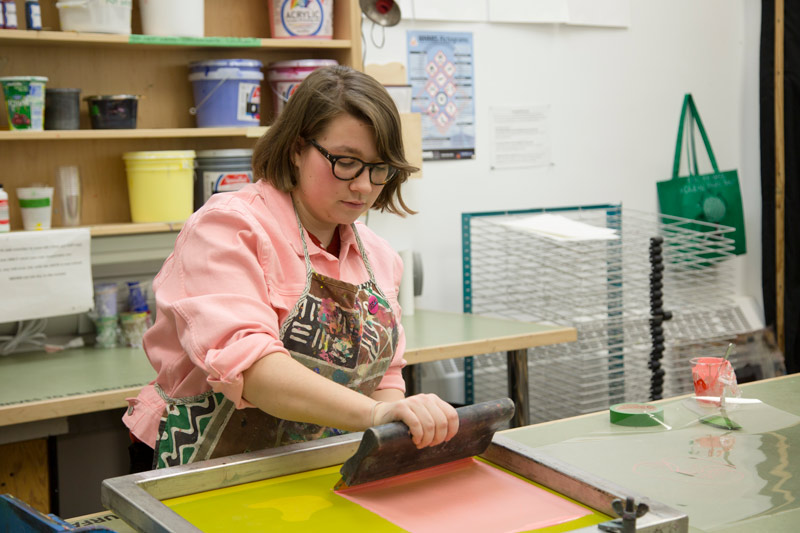 Student using silkscreen press