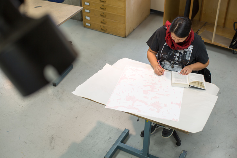 Student drawing in studio