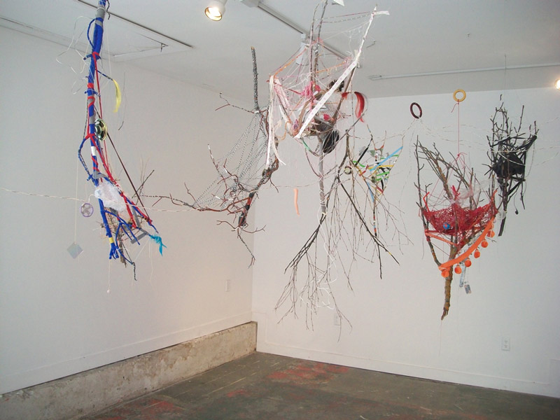 hanging art combining branches and yarn