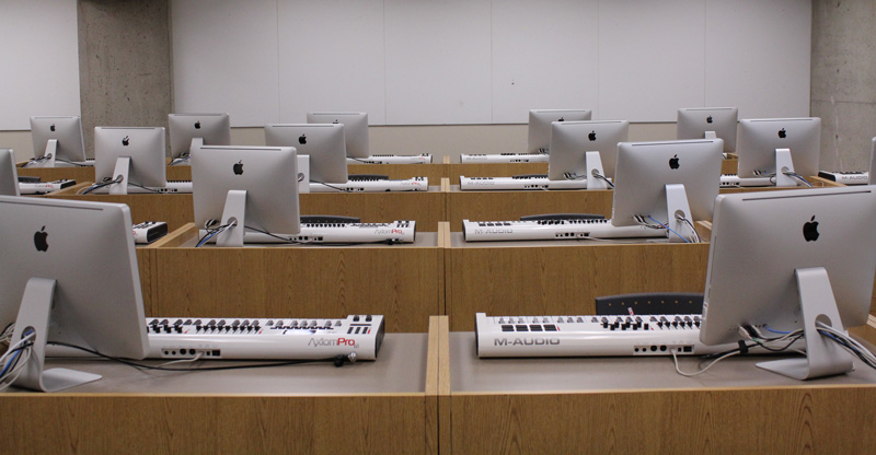 Lab of Mac computers and digital recording keyboards at each station