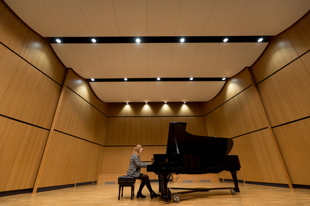 Recital hall stage with piano on it