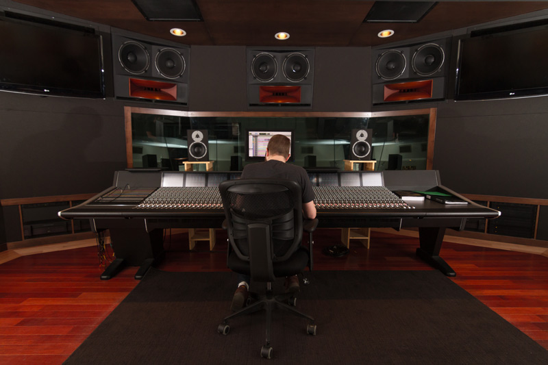 rear shot of student sitting at sound board