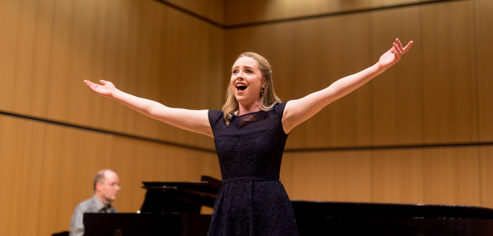 Singer with arms outstretched