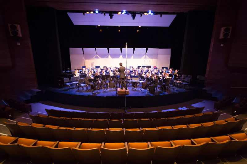 Wind orchestra performing on stage