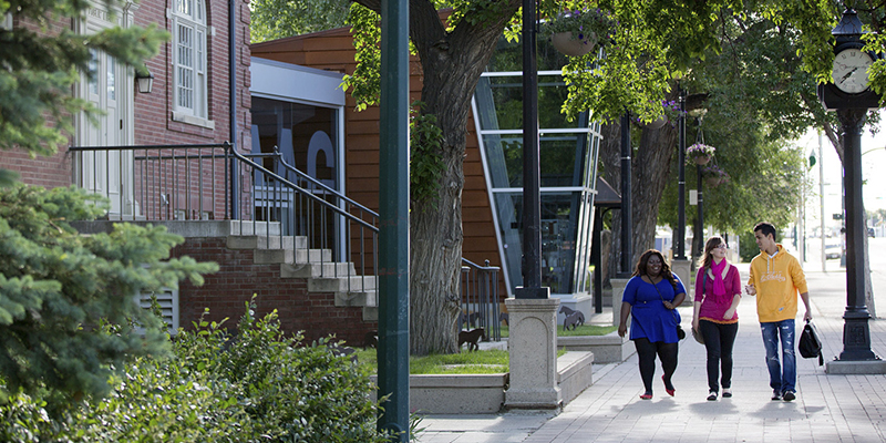 Students walking by art gallery