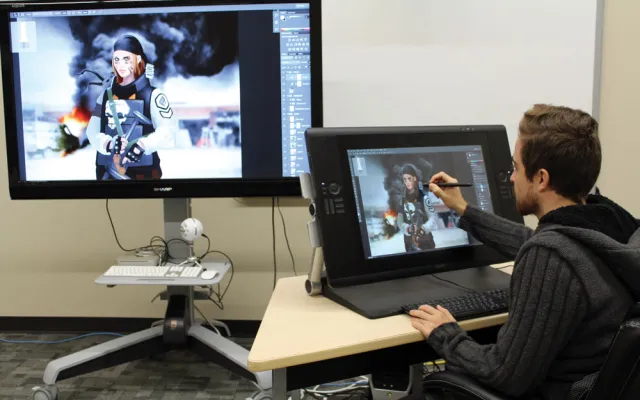 Student painting character in photoshop