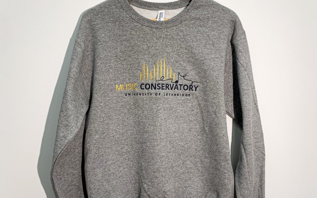 Grey sweatshirt on hanger with U of L Music Conservatory Logo on it
