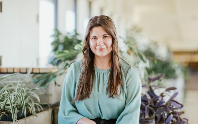 Female student sitting and smiling