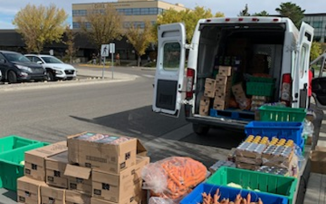 Staff from Lethbridge Food Bank bring a van with produce to handout to students once a month.