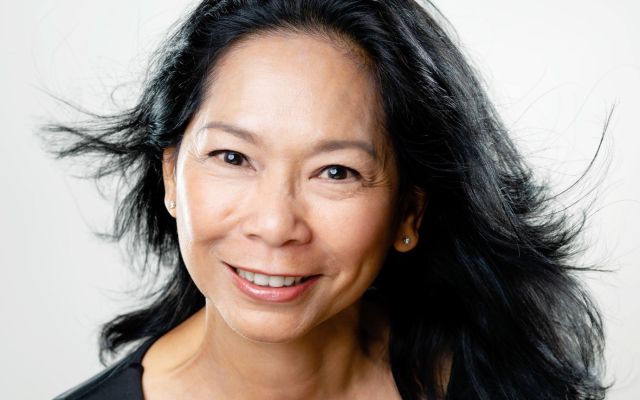 Photograph of Pat Lai Ngo Chan from the shoulders up.  She is a smiling woman with long black hair.