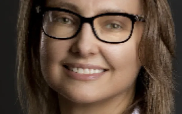 A headshot of Olga Kovalchuk.