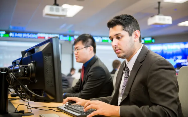 Student working within the DSB trading room