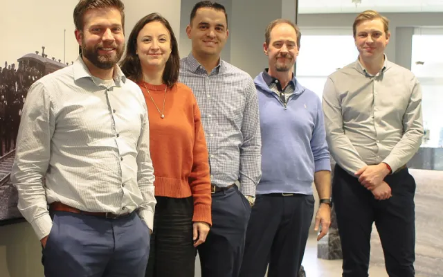 A photo of five individuals from Stringam Law standing together.