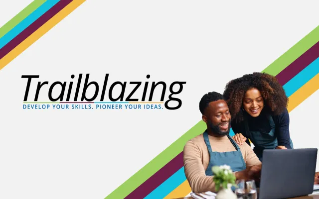Image of a man or woman smiling and looking at a laptop screen, cut out onto a white background with diagonal colored lines, green, maroon, blue, and gold. Next to them is the Trailblazing logo.