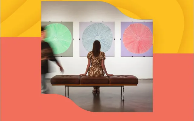 Person sitting on a bench interpreting art