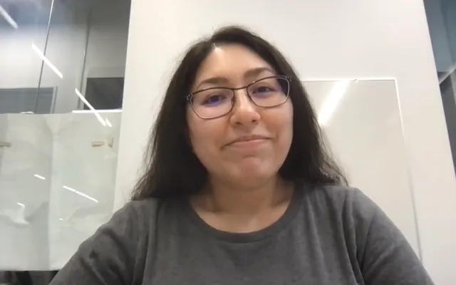 Woman in front of a white background