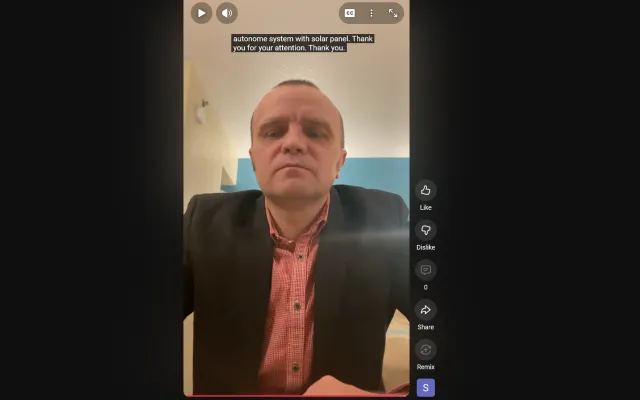 Man in a pink button up and black jacket