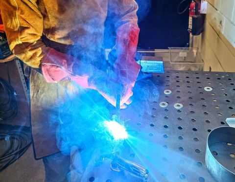 Student Welding in Tech Services