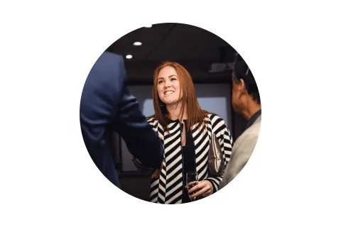 Your Next Job Stock Circle Test Photo of a red-headed women shaking hands with a suite in a circular frame