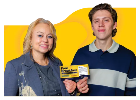 Josh and Cyndi holding Breakfast Coupon