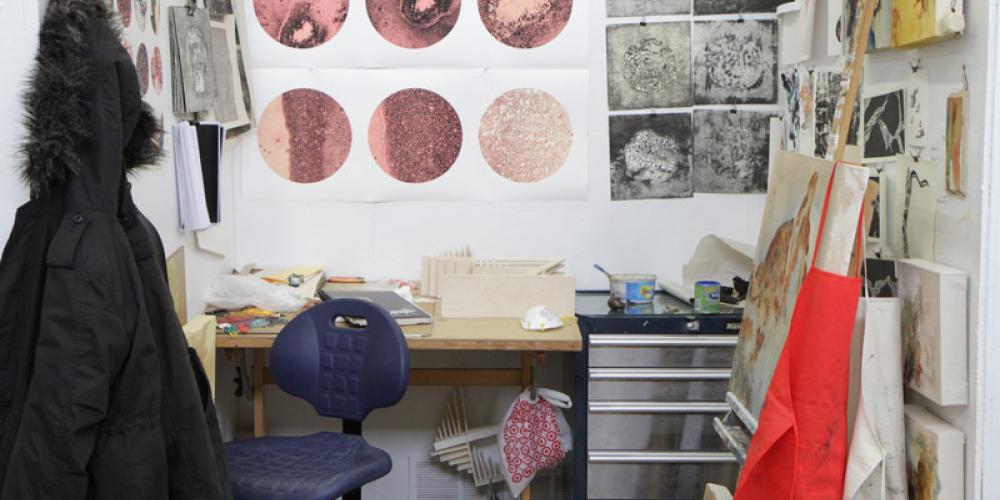 Desk with drawings on walls