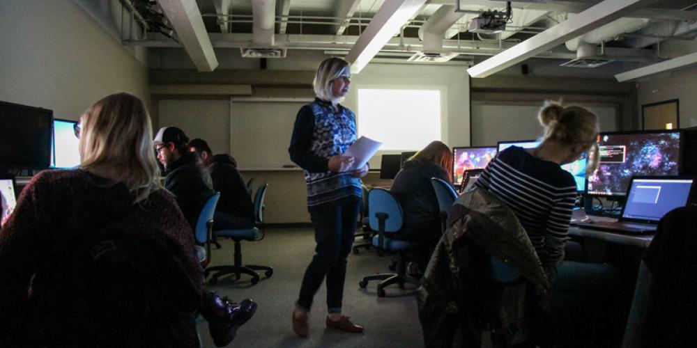 Christine Clark teaching new media class in computer lab