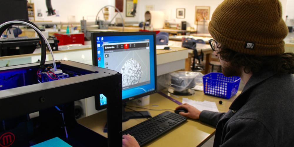 Student using software for 3D printer