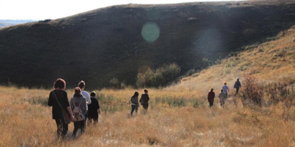 students walking up coulee