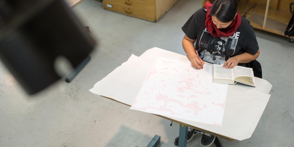 Student drawing in studio