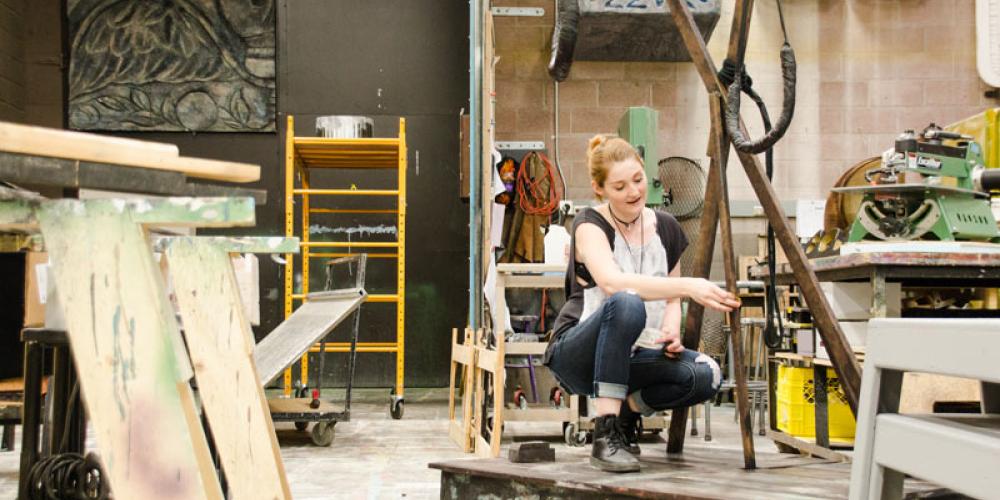 Student working in prop shop
