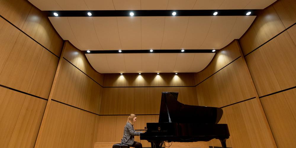 Recital hall stage with piano on it
