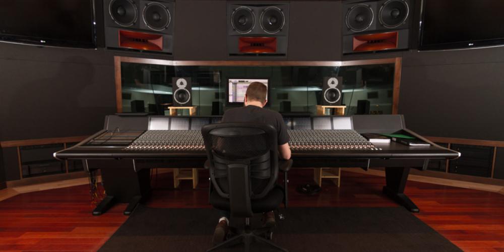 rear shot of student sitting at sound board
