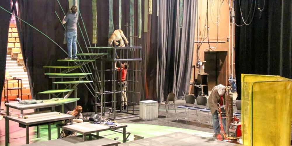 constructing a set on stage for a drama prodcution