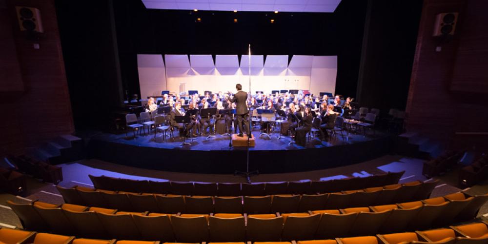 Wind orchestra performing on stage