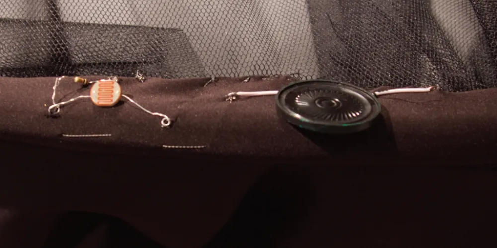 Michelle Sylvestre, Detail from Little Black Dress 1.2 - textile, electronics, video (2020)