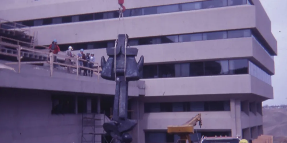 Moses sculpture being lifted by a crane