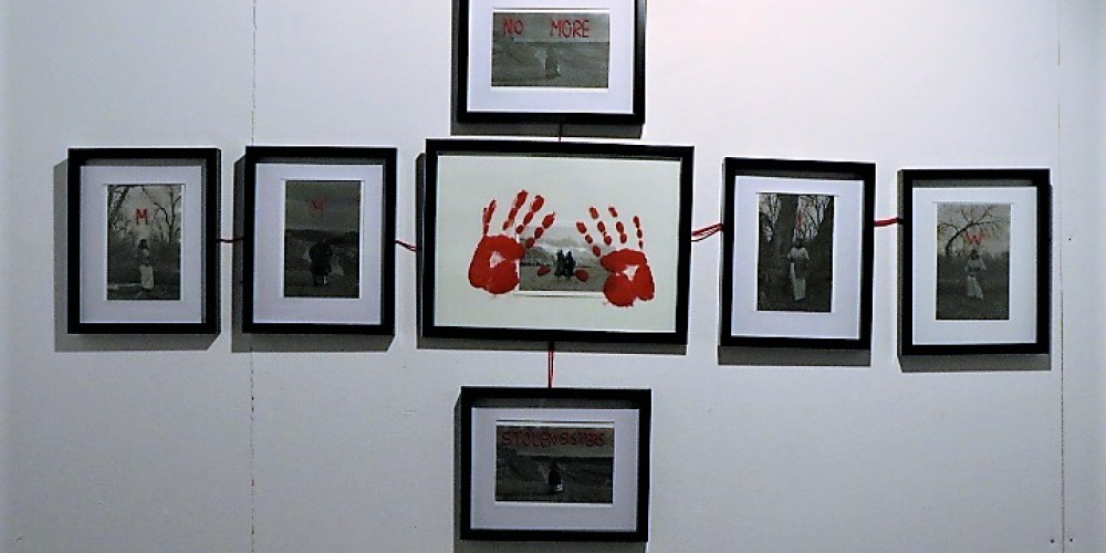Installation view of artwork by Chataya Holy Singer called Resilience, 2021. String beads on pearl film photo paper, analogue photography, red acrylic, and red thread. Six 16.51cm x 22.86cm photos, and one 10.16cm x 15.24cm photo.