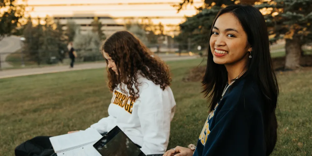 Students smiling at viewer