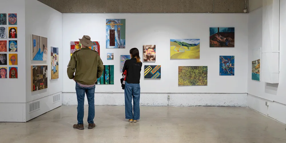 Public viewing student paintings installed at Vibe Fest