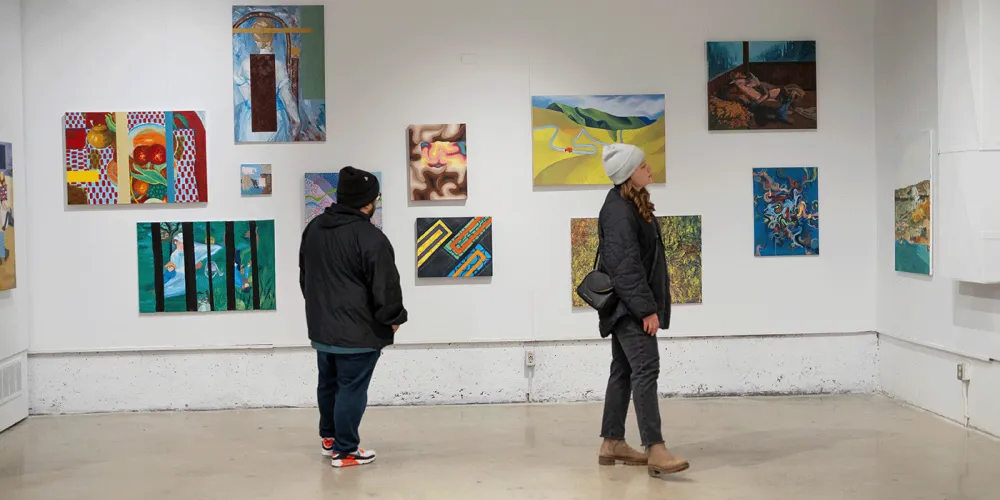 Public viewing student paintings installed at Vibe Fest