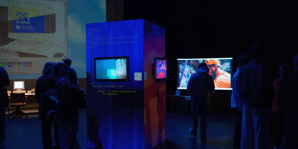 People enjoying the Department of New Media 25th Anniversary Retrospective Exhibition at Vibe Fest