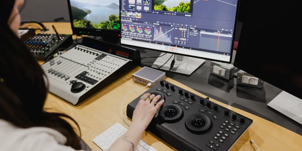 Student in a cinema editing suite.