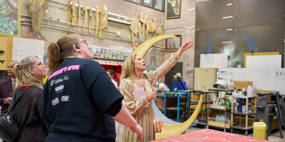 People touring a scene shop.