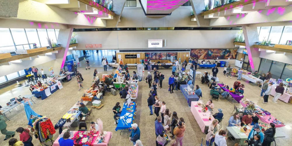 A crowded art market in the UHall Atrium at Vibe Fest.