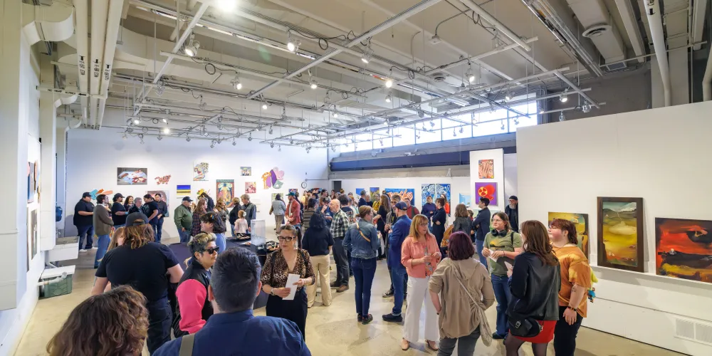 A group of people at an art awards event at Vibe Fest.