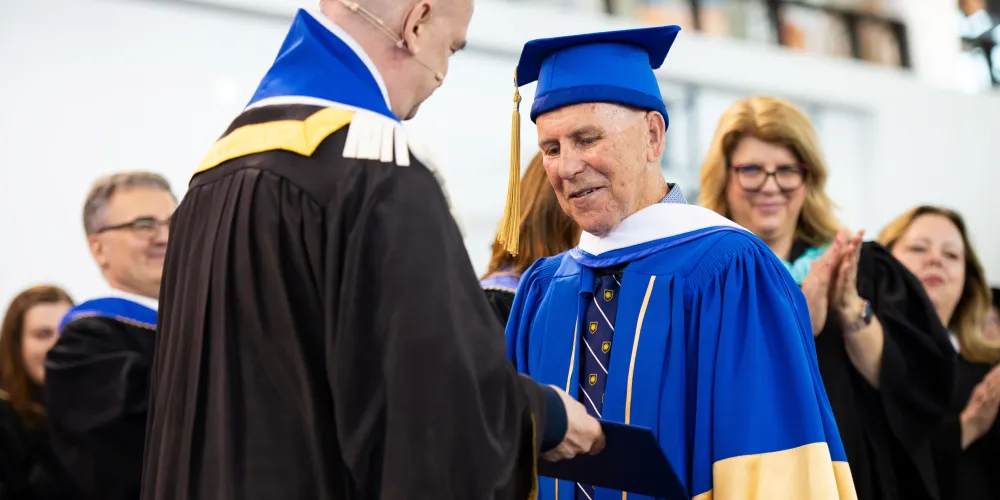 An Honourary Degree Recipient receiving his degree 