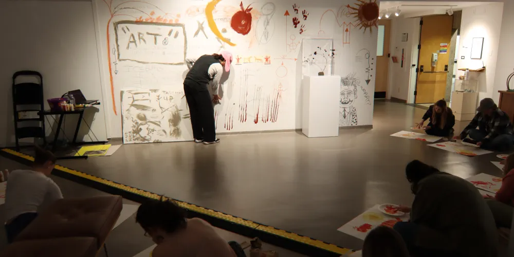 A group of students in an art gallery