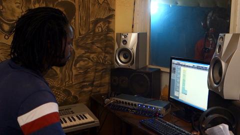 Still capture from Emmanuelle Olivier's video of Ken Lagare (arranger/engineer) and General Ballody (reggae singer). Image courtesy of Amandine Pras. Still capture from Emmanuelle Olivier's video of Ken Lagare (arranger/engineer) and General Ballody (reggae singer). Image courtesy of Amandine Pras