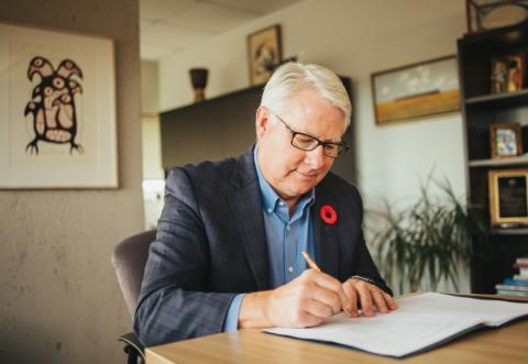 President and Vice-Chancellor Dr. Mike Mahon signs the Scarborough Charter