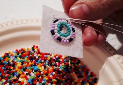 Hand holding beads